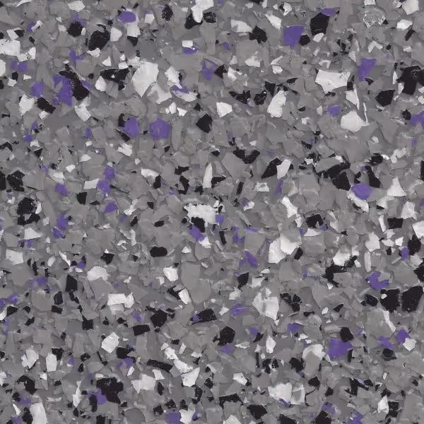 Epoxy floor coating with scattered flakes in shades of gray, black, white, and purple.