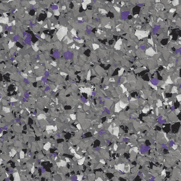 Epoxy floor coating with scattered flakes in shades of gray, black, white, and purple.