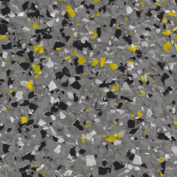 Epoxy floor with gray base and scattered flakes in black, white, and yellow colors.
