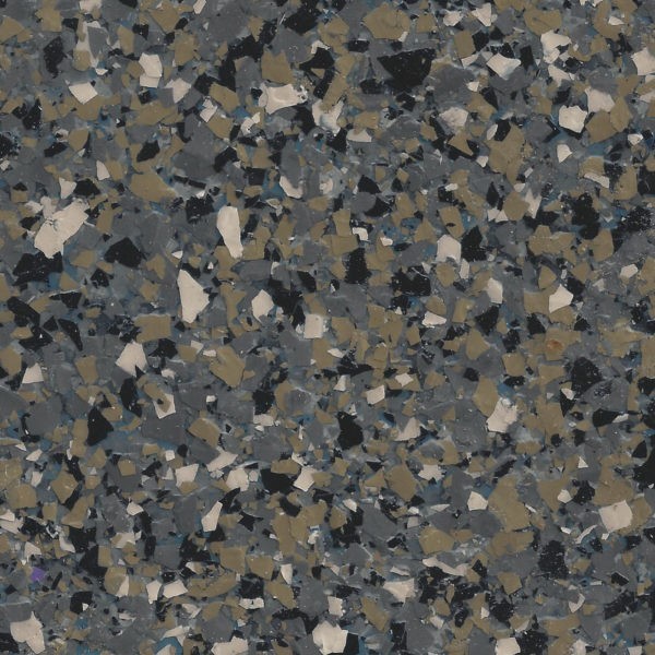 Epoxy floor surface with a dense pattern of mixed flakes in gray, beige, black, and cream colors.