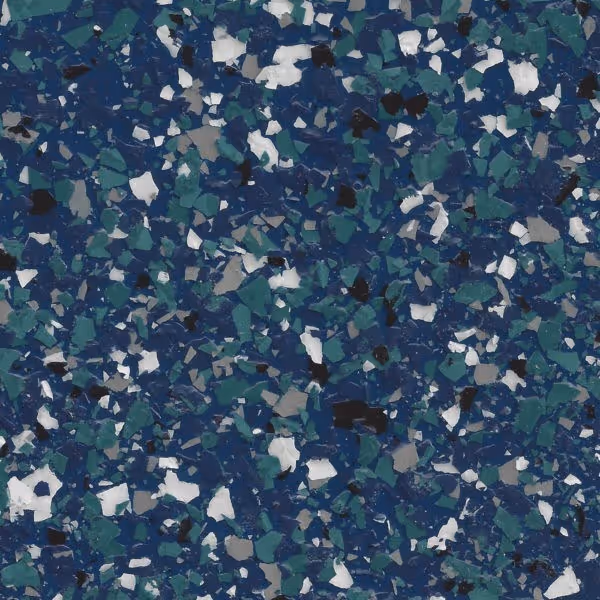 Close-up of a blue epoxy floor coating with green, white, gray, and black decorative flakes.