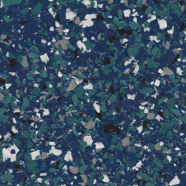 Close-up of a blue epoxy floor coating with green, white, gray, and black decorative flakes.