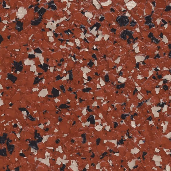 Close-up of a terracotta epoxy flake surface with scattered black and white flakes.