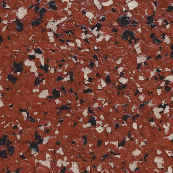 Close-up of a terracotta epoxy flake surface with scattered black and white flakes.