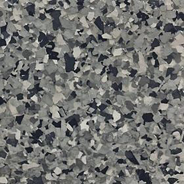 Close-up of multi-shade gray epoxy flake flooring with irregular, scattered chip patterns.