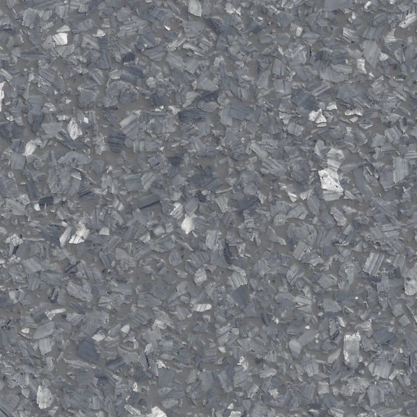 Close-up texture of basalt rock with crystalline, fragmented gray surface.