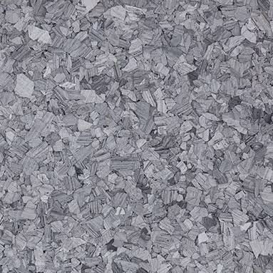 Close-up of a grey onyx stone surface with irregular textured patterns and shades of gray.