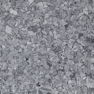 Close-up of a grey onyx stone surface with irregular textured patterns and shades of gray.