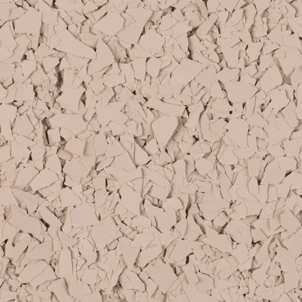 Close-up view of beige-colored irregularly shaped flakes scattered evenly.