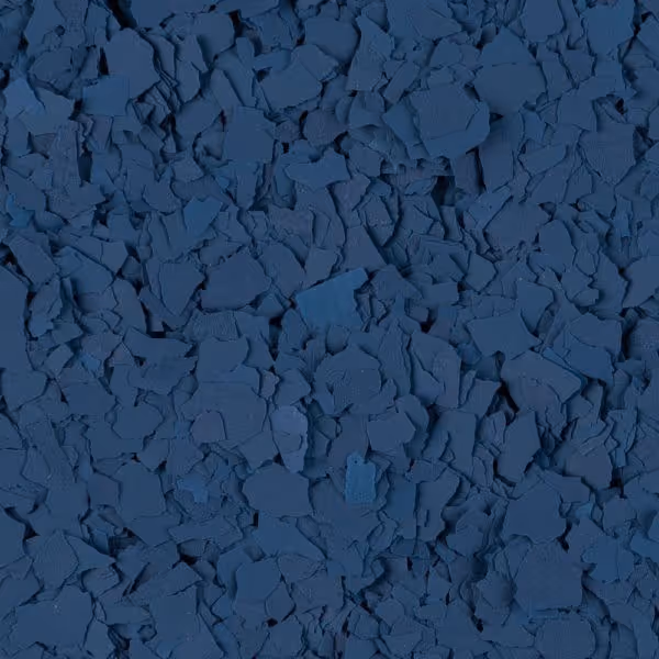 Close-up of irregularly shaped dark blue flakes densely layered together.