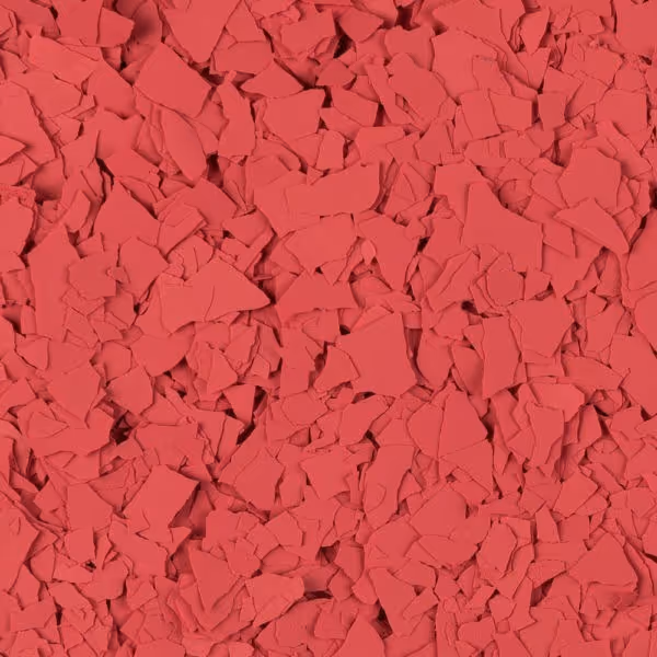 Close-up of irregular red flakes scattered densely.