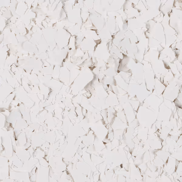 Close-up of numerous small, irregular white flakes scattered evenly.