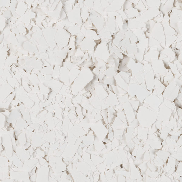 Close-up of numerous small, irregular white flakes scattered evenly.