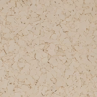 Close-up view of irregular cream-colored flakes scattered densely on a surface.