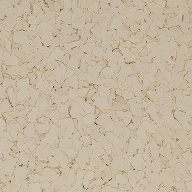 Close-up view of irregular cream-colored flakes scattered densely on a surface.
