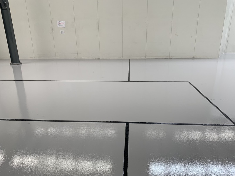 Industrial single color epoxy floor with safety bay lines in melbourne