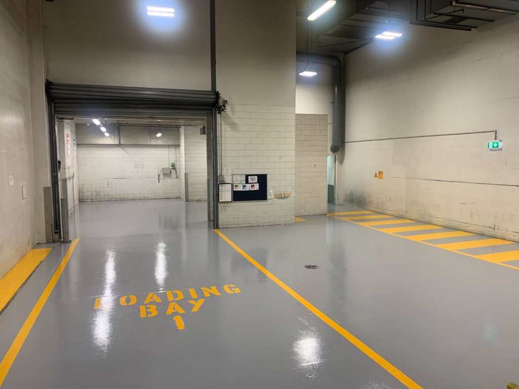 Industrial gray color epoxy floor with safety lines in melbourne vic