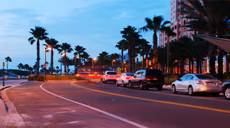 Cars driving by the office of a Clearwater personal injury attorney.