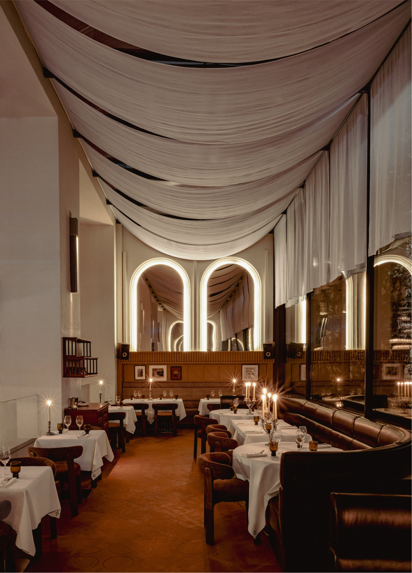 Long dining room with arches and white tablecloths at Temple & Chapon, Experimental Marais, Paris