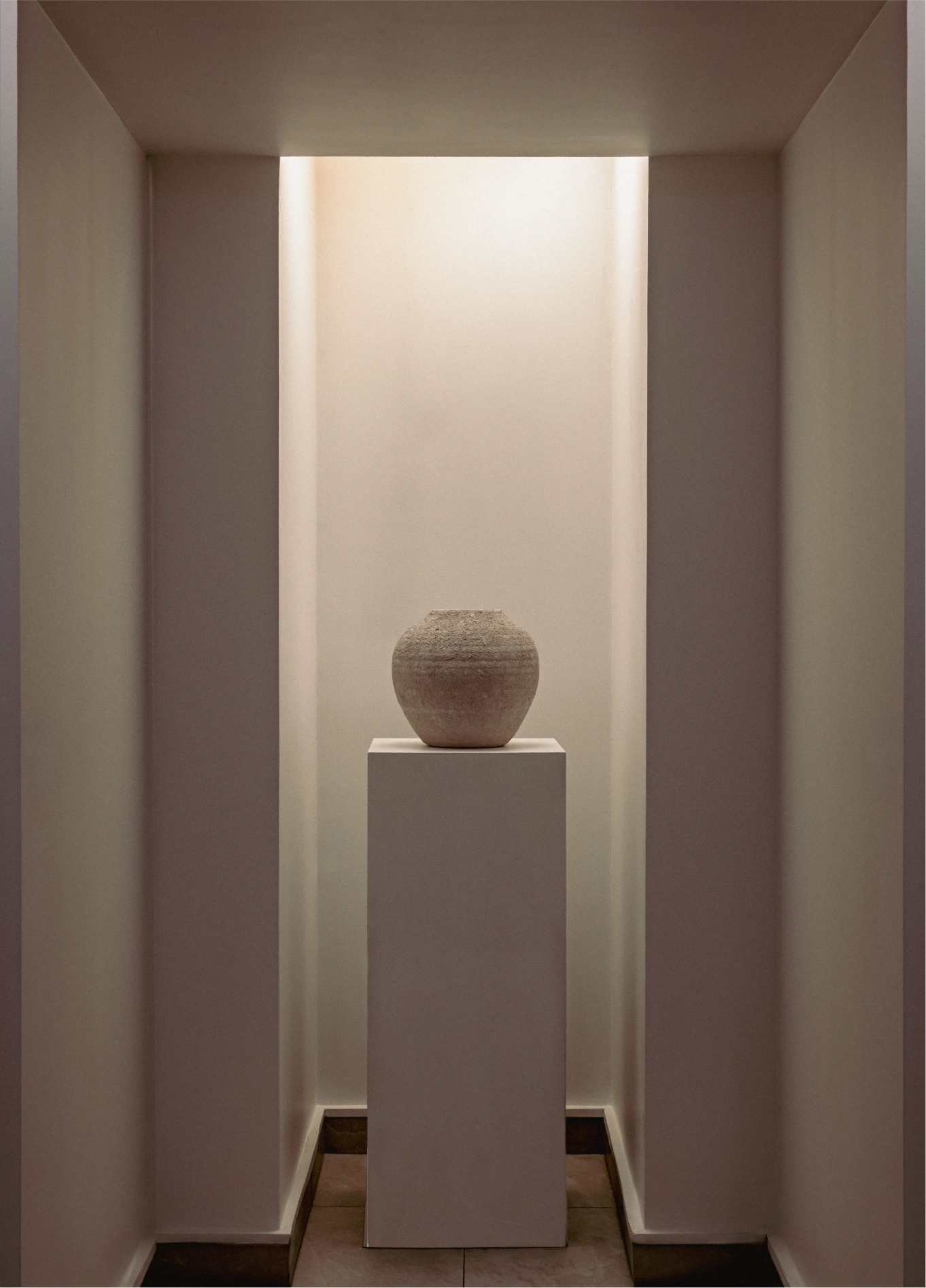 Minimalist corridor with sculpture on pedestal at Spa by Experimental, Marais, Paris
