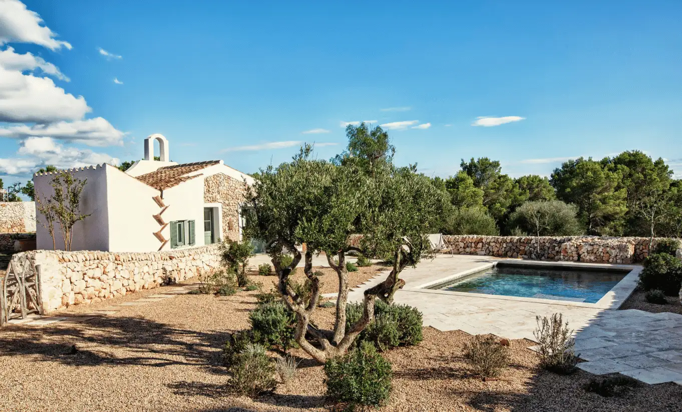 Menorca Experimental by Experimental Group – whitewashed stone villa with private pool surrounded by ancient olive trees and unspoiled Menorcan countryside