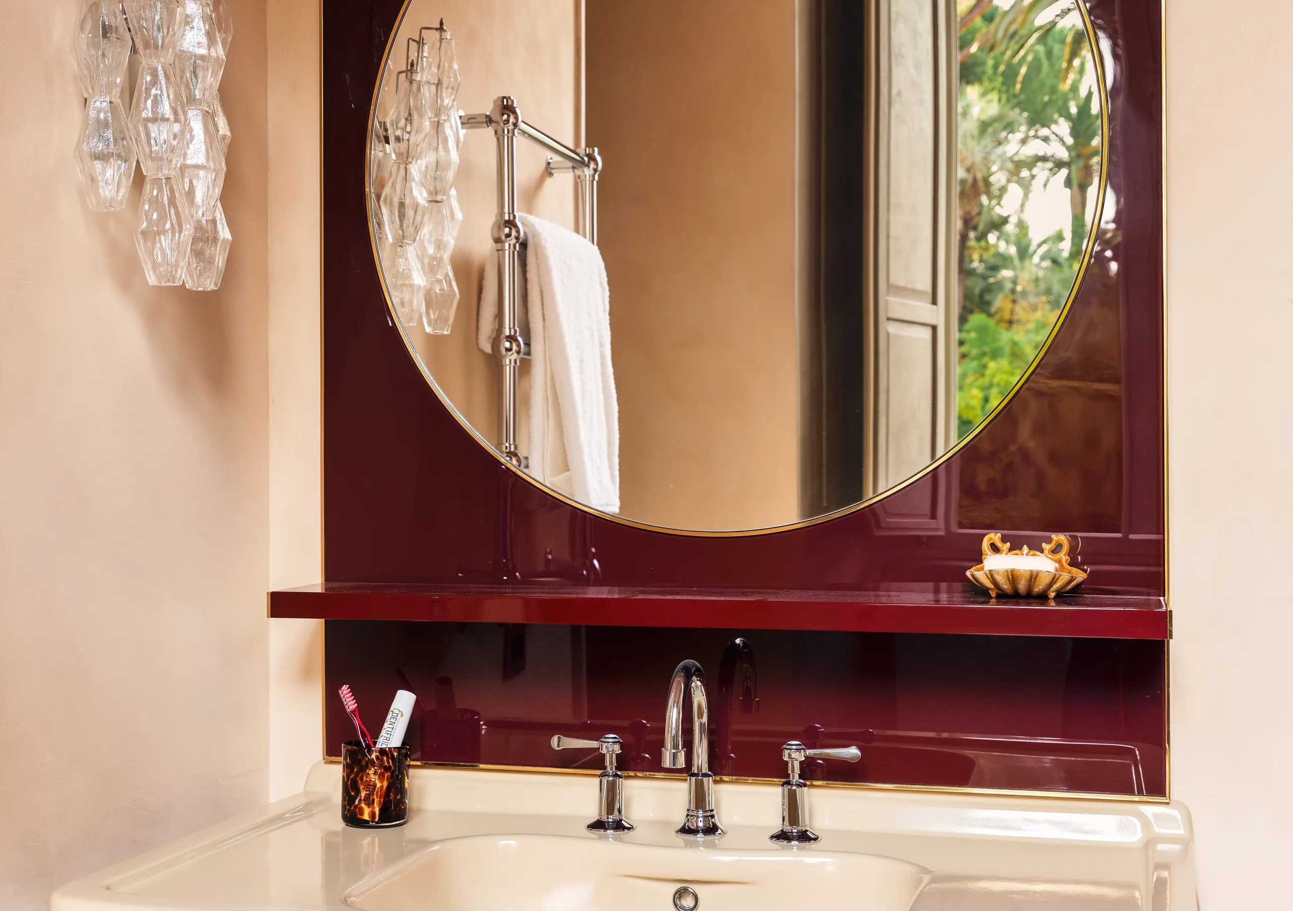 Refined bathroom with round mirror and modern sink at Experimental Group