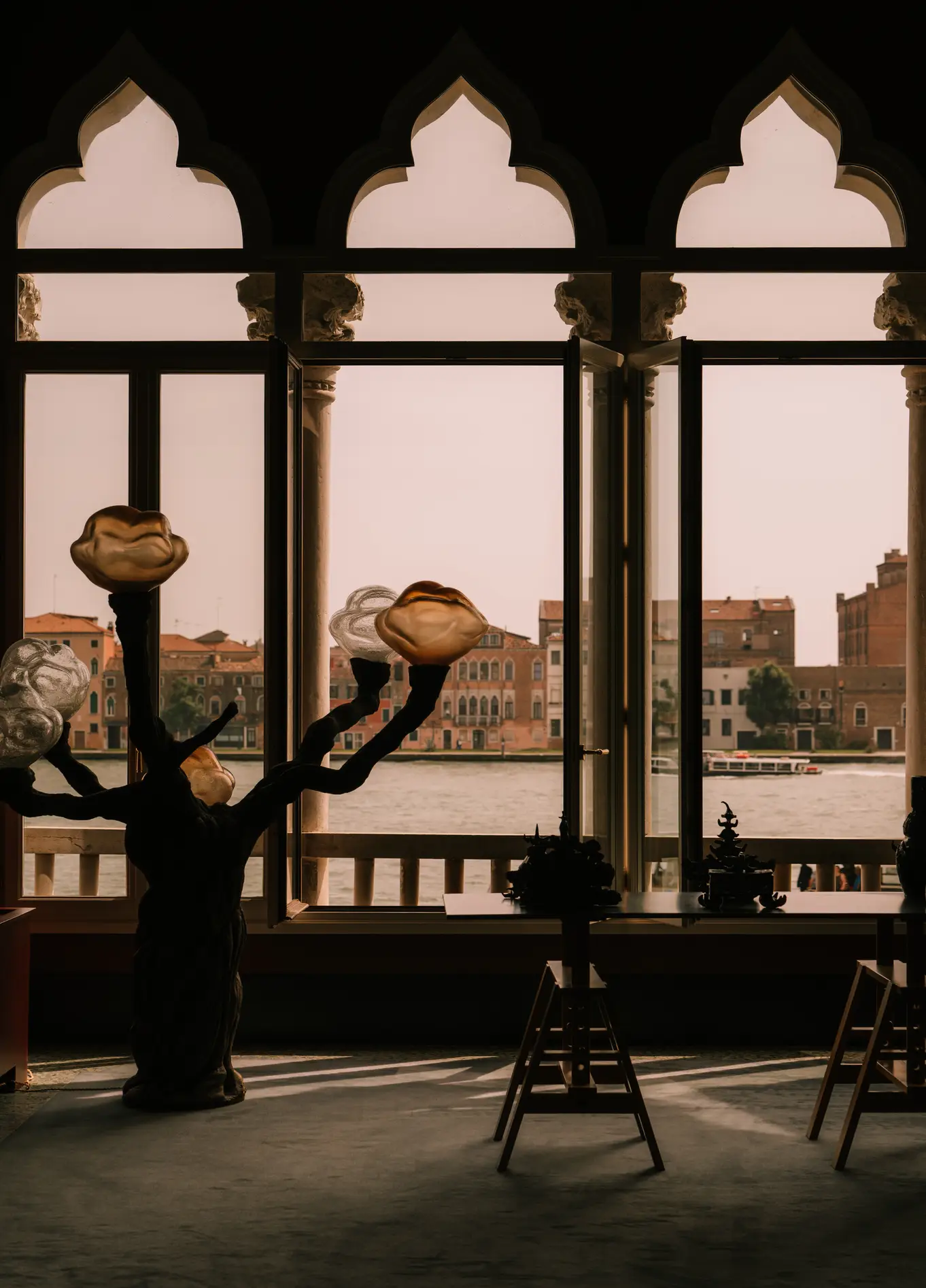 View of the Grand Canal through arched windows at Il Palazzo Experimental, Venice