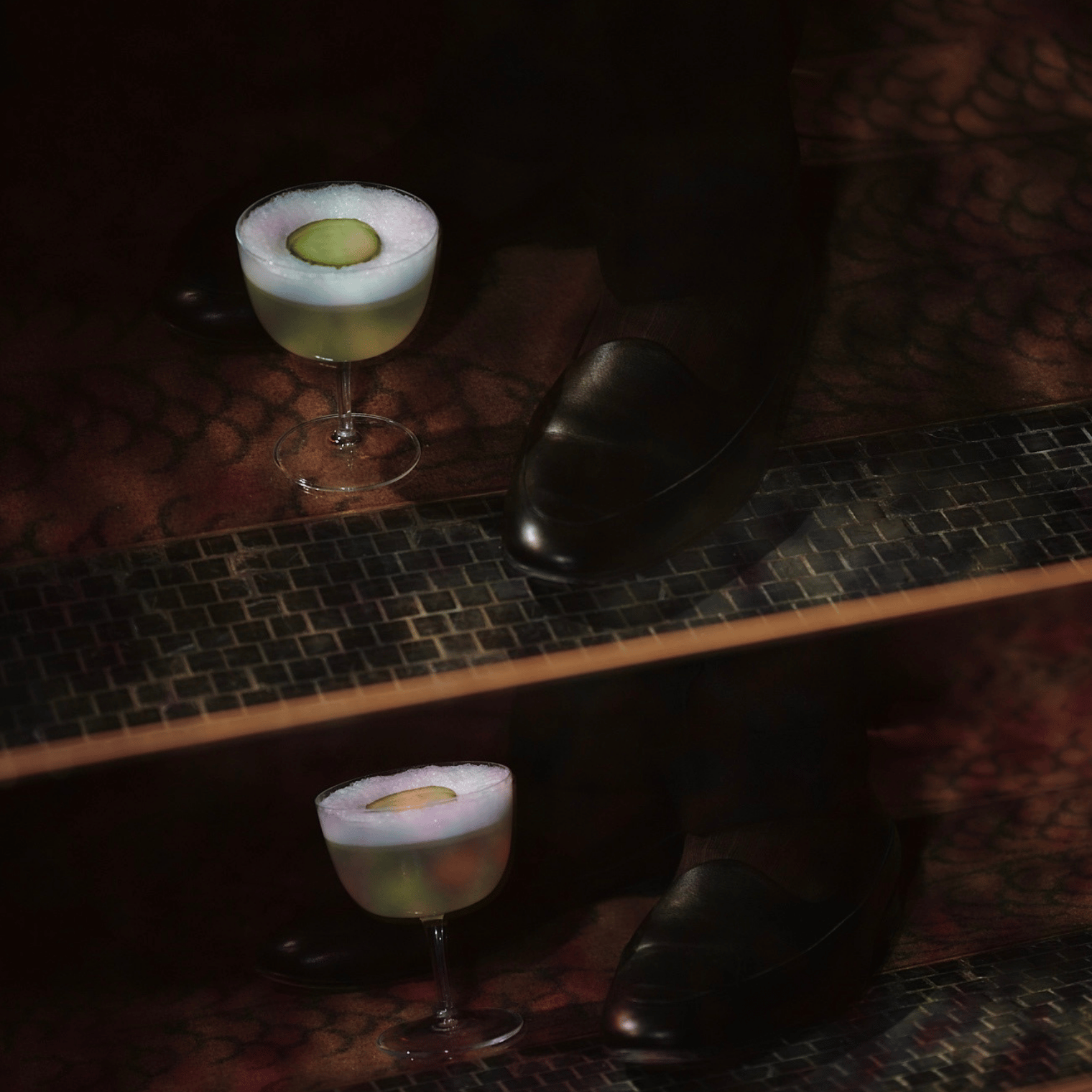 Cocktail on floor by shoe.