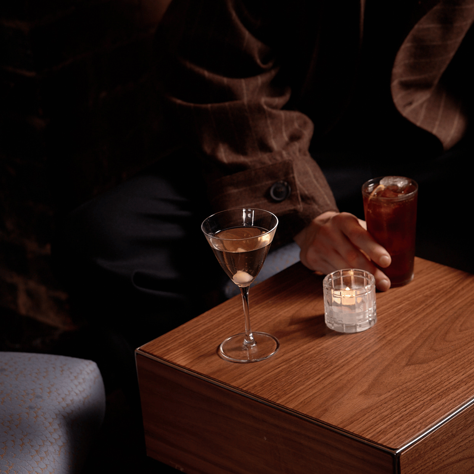 A cocktail poured on the bar.
