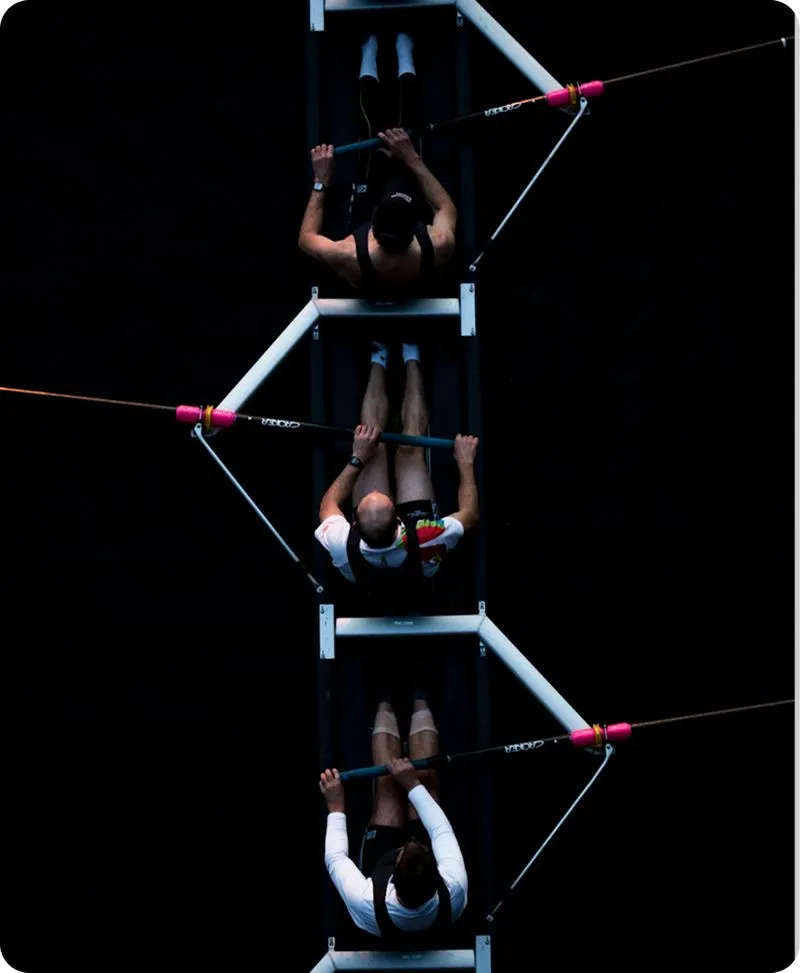 A man is doing a trick on a pole.