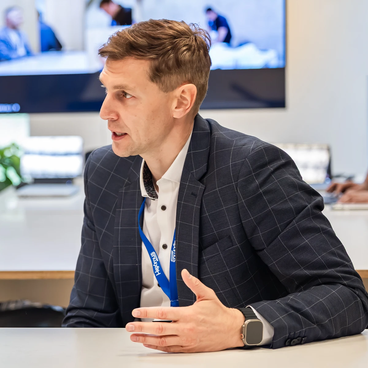 Heximus representative speaking during a business meeting at the company’s office.