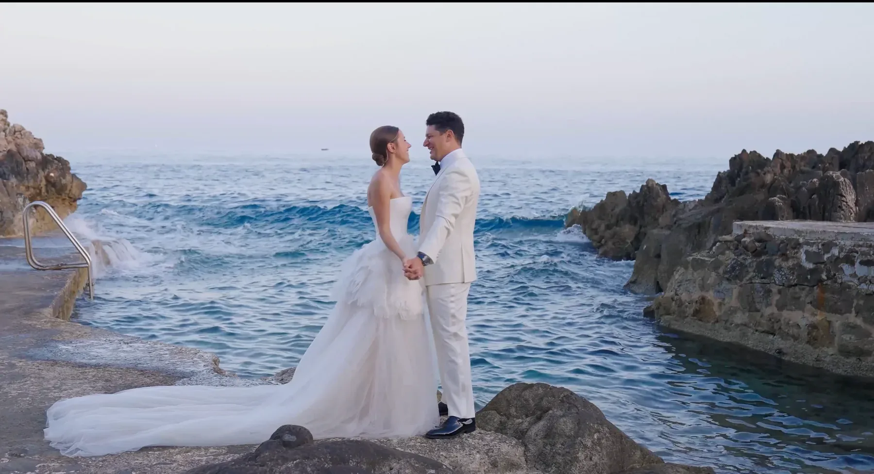 Bride and groom portrait on the rocky coastline at Four Seasons Cap Ferrat