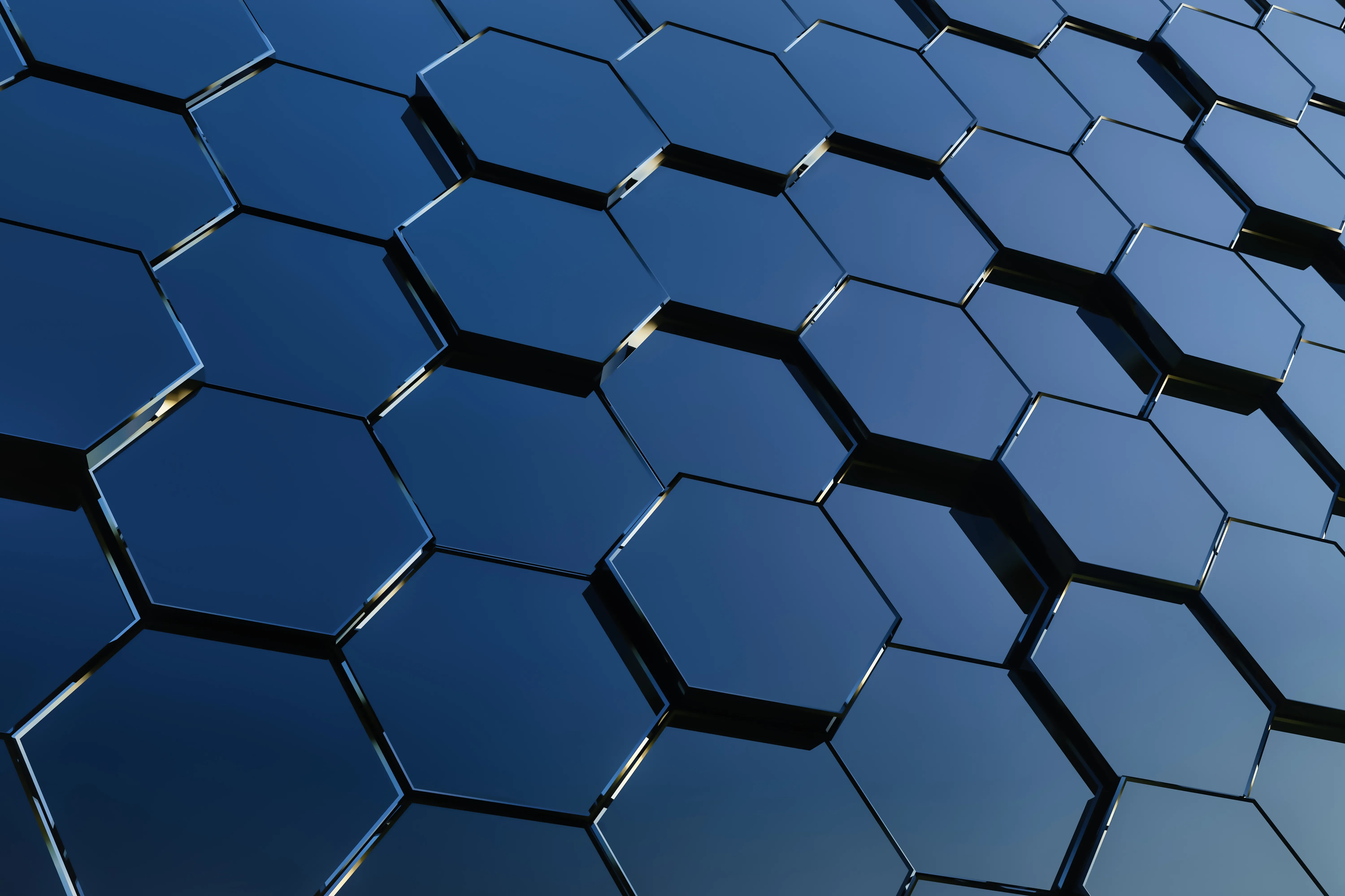 Sfondo astratto con esagoni blu tridimensionali, simbolo di tecnologia, innovazione, rete digitale, modularità e sistemi interconnessi.