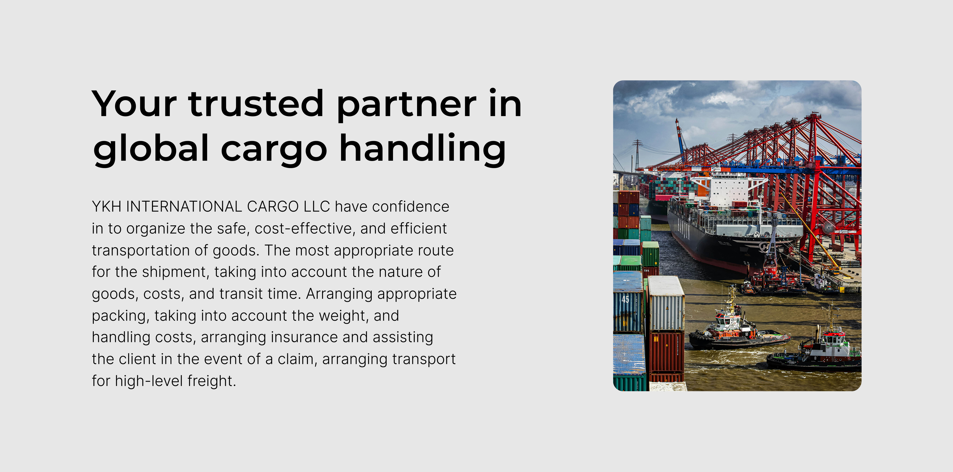 Cargo ship docked at port with stacked shipping containers and cranes in the background.