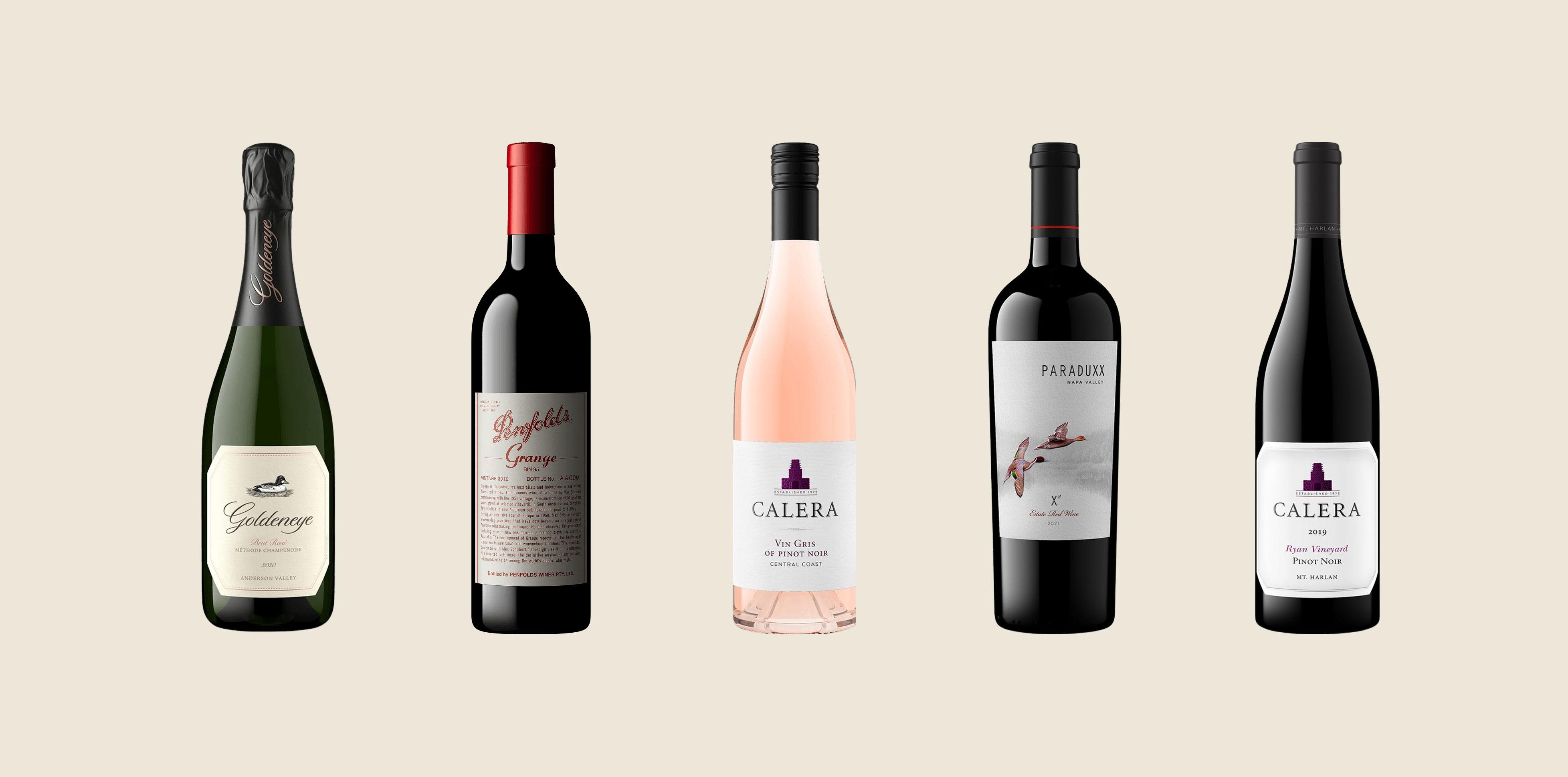 Five wine bottles lined up: sparkling, red, rosé, red with duck label, and pinot noir.