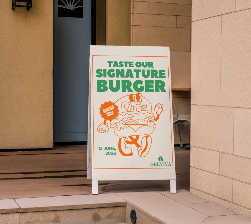 Sign board outside a building advertising a signature burger special offer at Greviva on June 13, 2026.