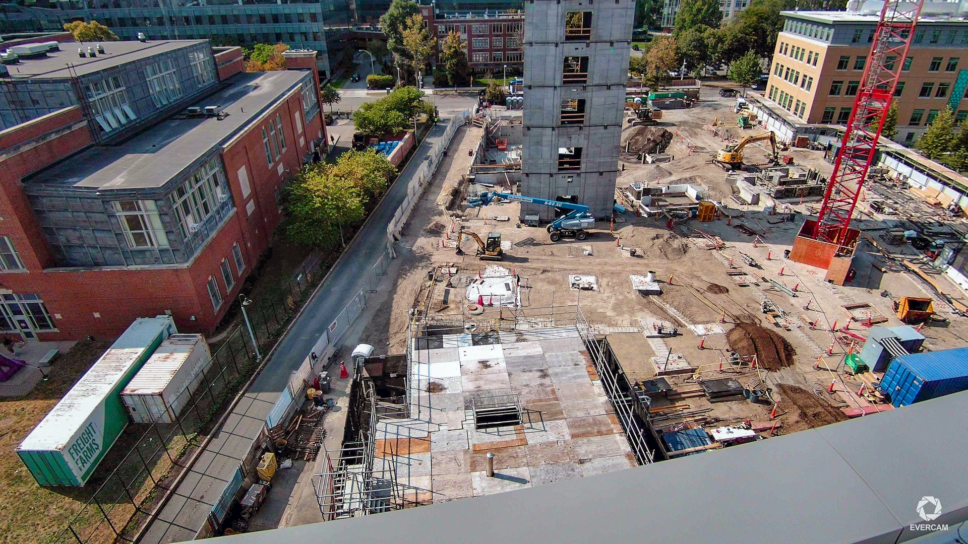 Elevated construction camera view showing structural works and site activity at the Simmons University project.