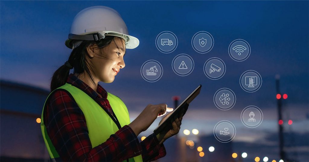 a construction woman holding tablet in her hand in a construction site