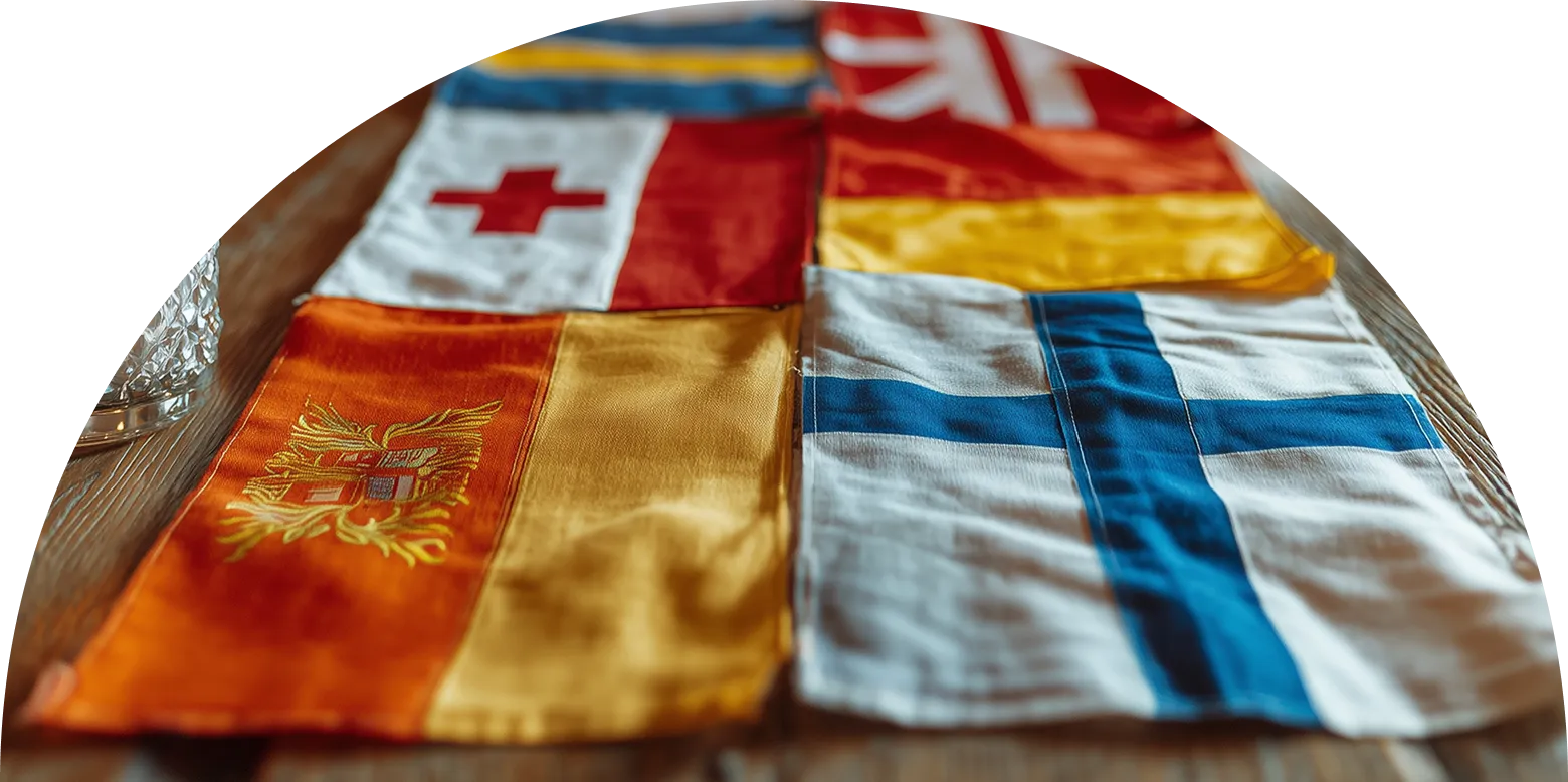 Six colorful signal flags laid out on a wooden surface.