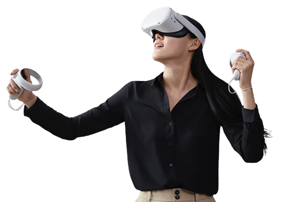 Woman wearing a virtual reality headset and holding VR controllers, looking upward and engaged in VR experience.