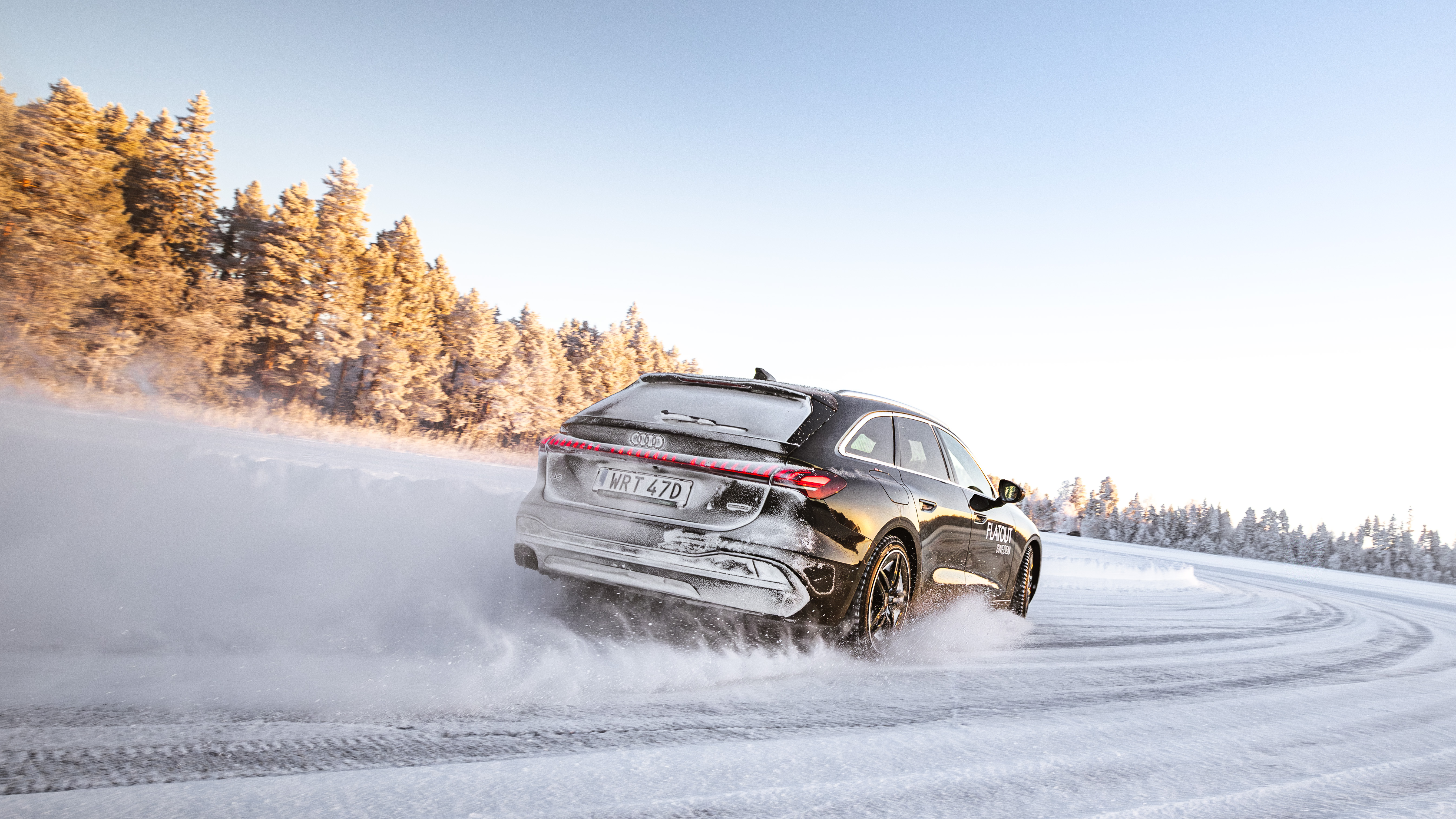 An Audi cornering on the prepared ice track in Östersund, Sweden