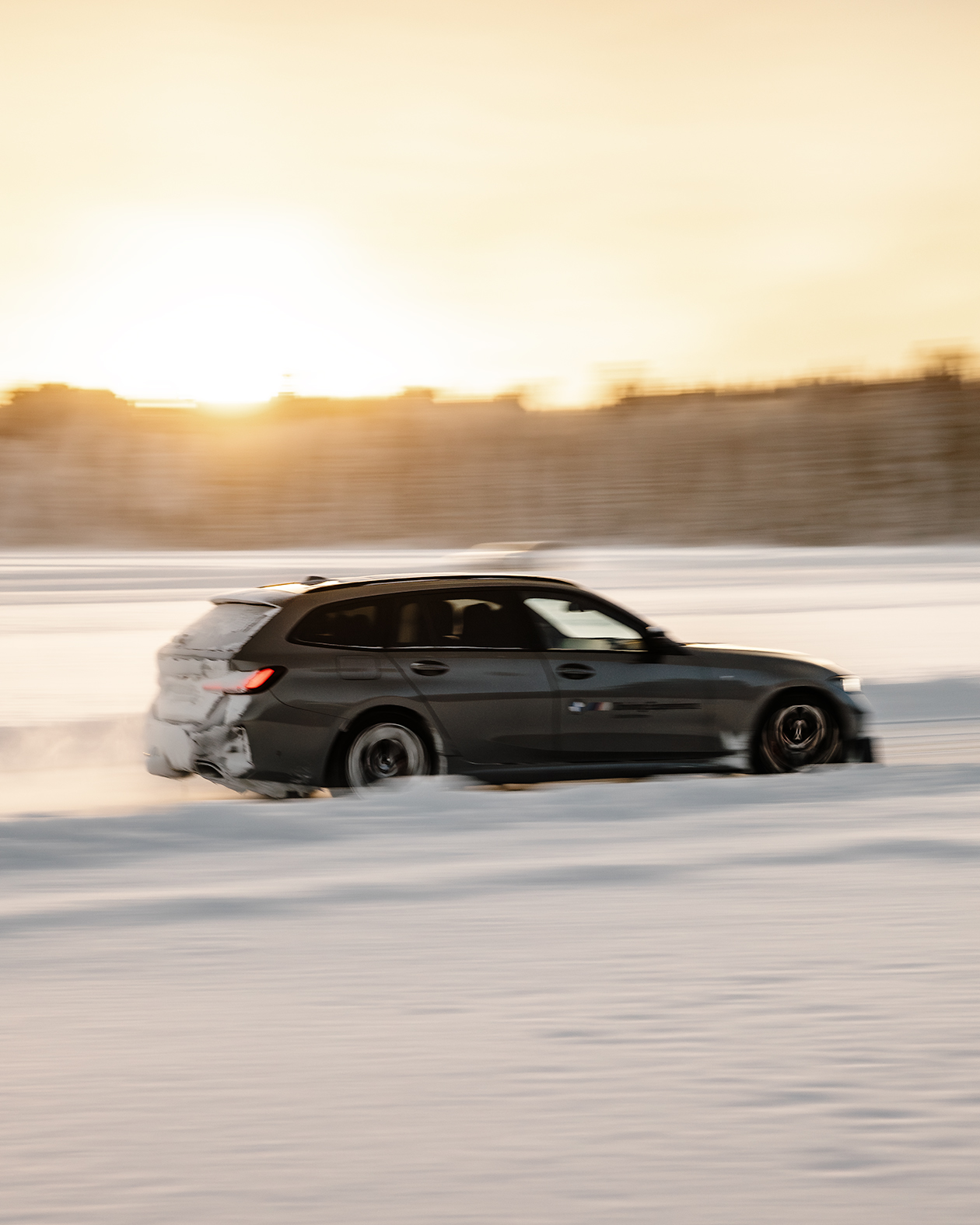 A BMW on the snow-lined ice driving track in Kall/Åre, Sweden