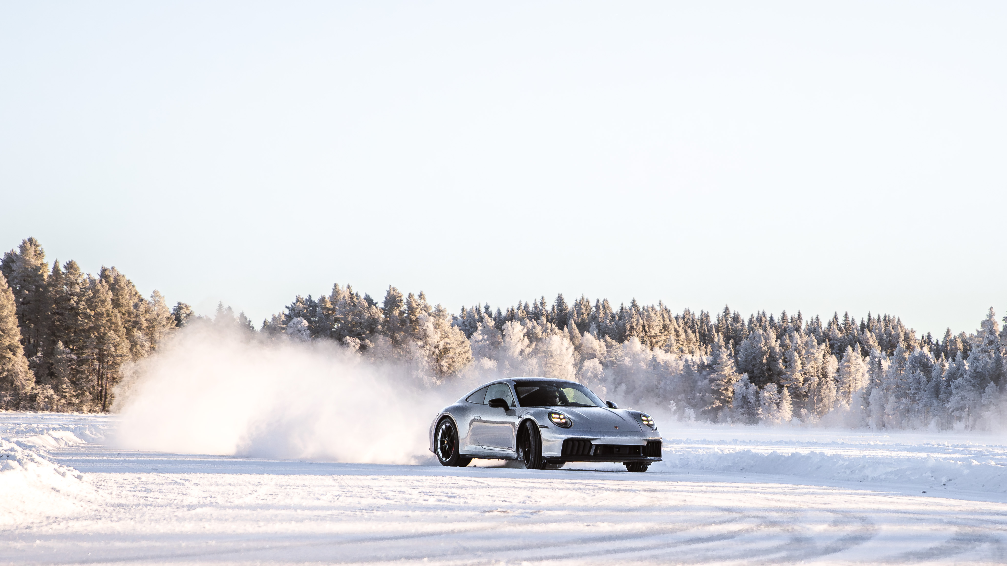 A Porsche on the snow-lined ice driving track in Östersund, Sweden