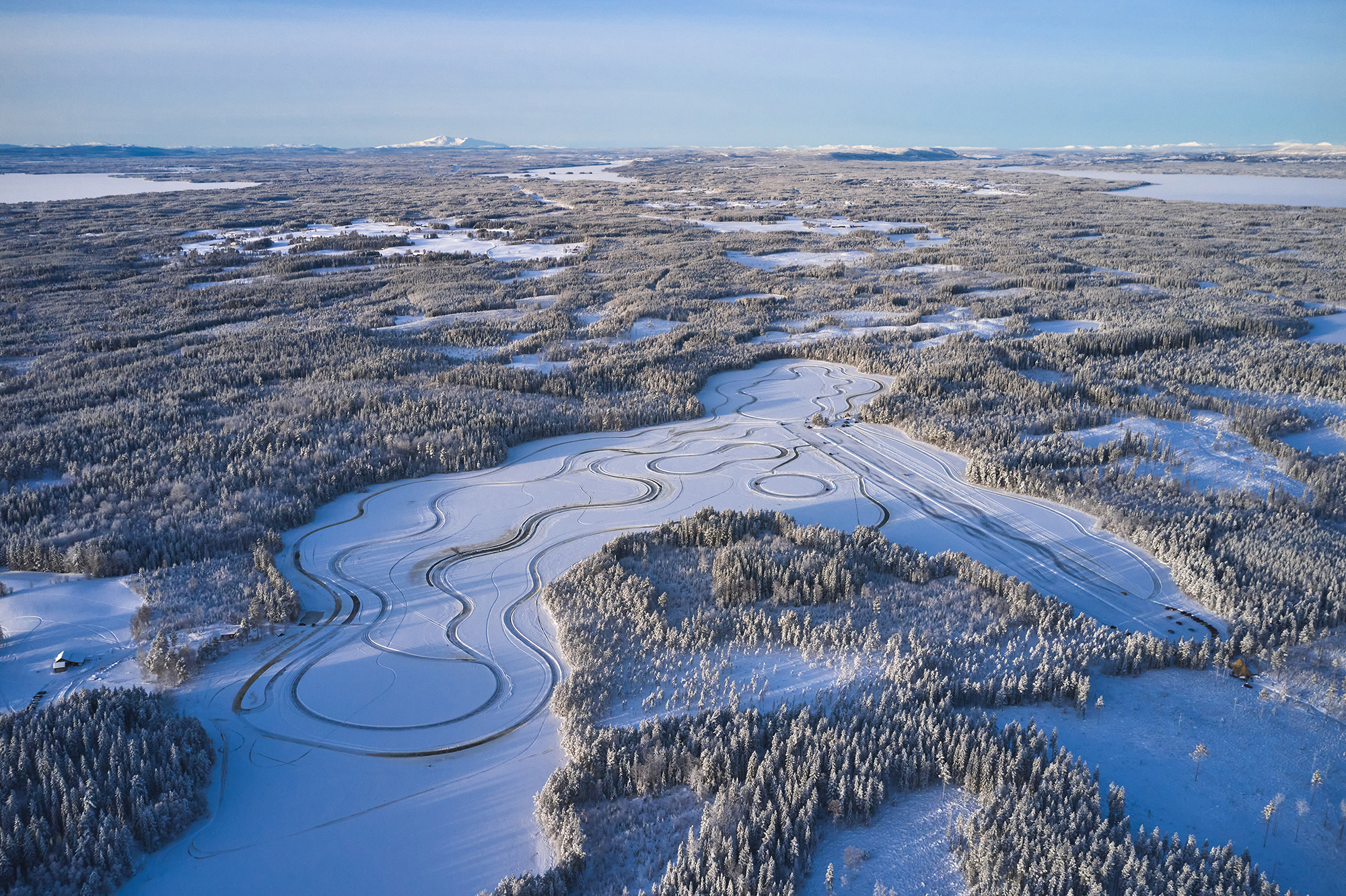 Aerial view of a Skoda on a frozen lake ice track in Östersund, Sweden