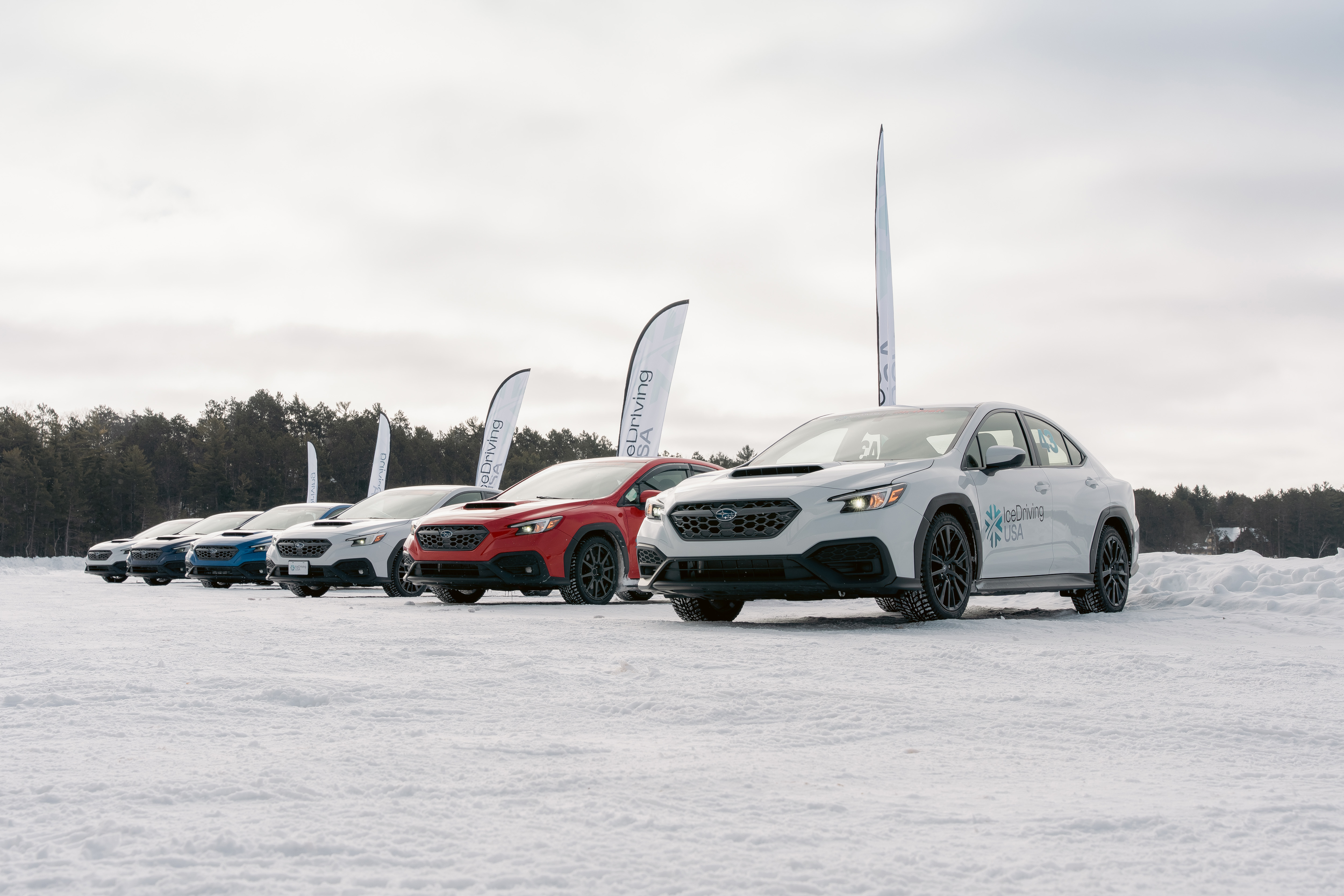 A Subaru WRX drifting across the ice at the event in Eagle River, Wisconsin