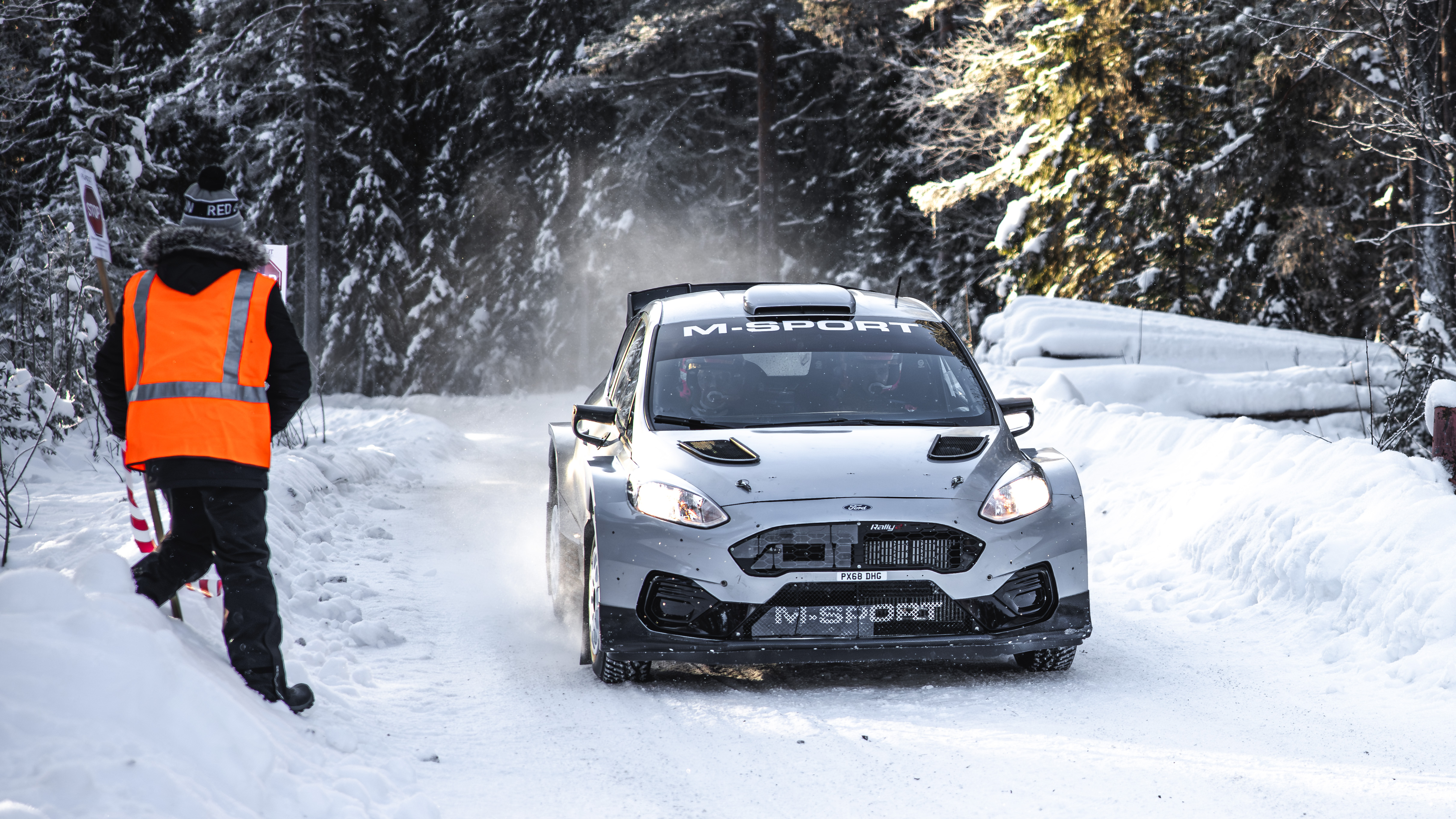 A rally test car drifting across the ice at the event in Jämtland, Sweden