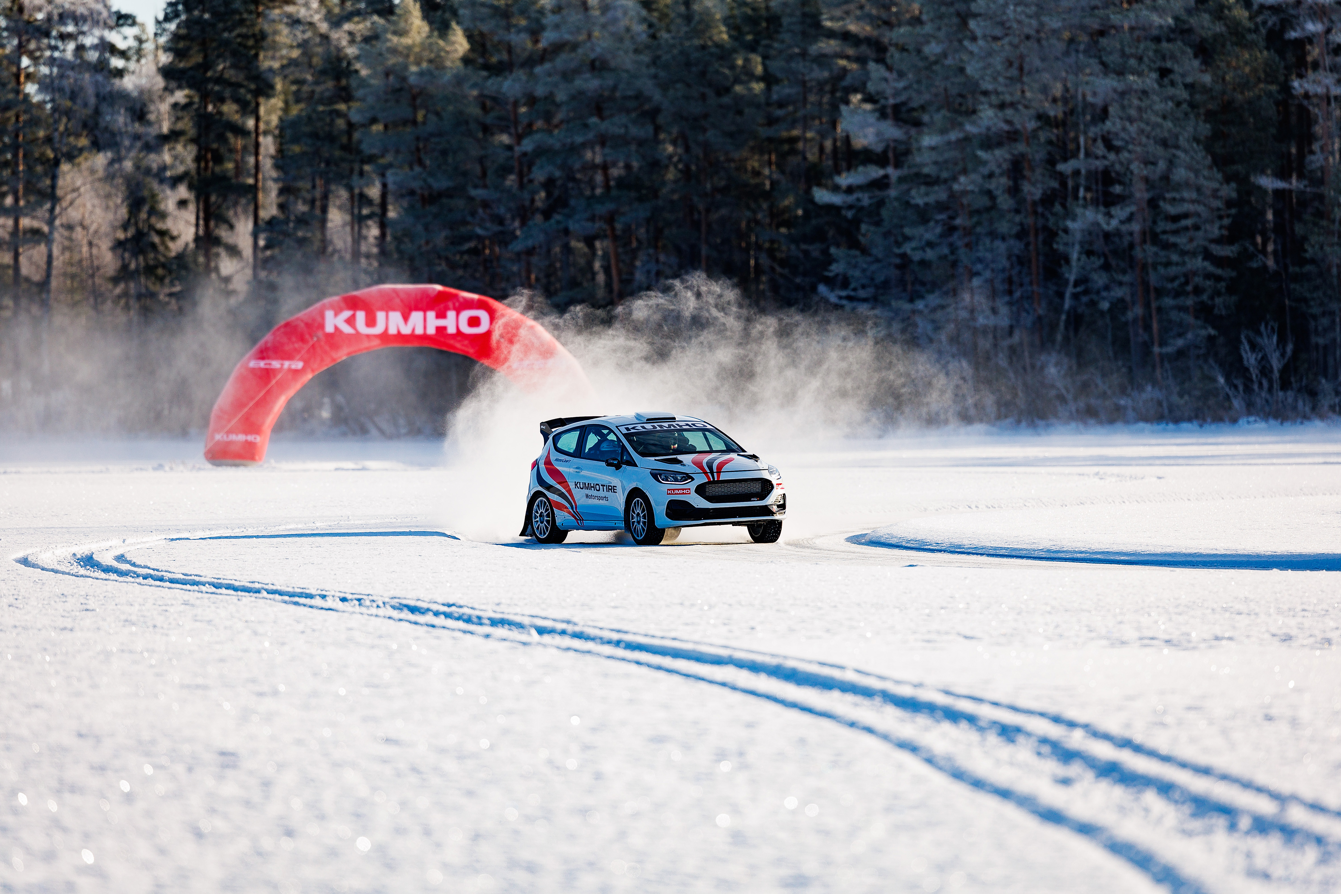 A Kumho tire test car cornering on the prepared ice track in Östersund, Sweden