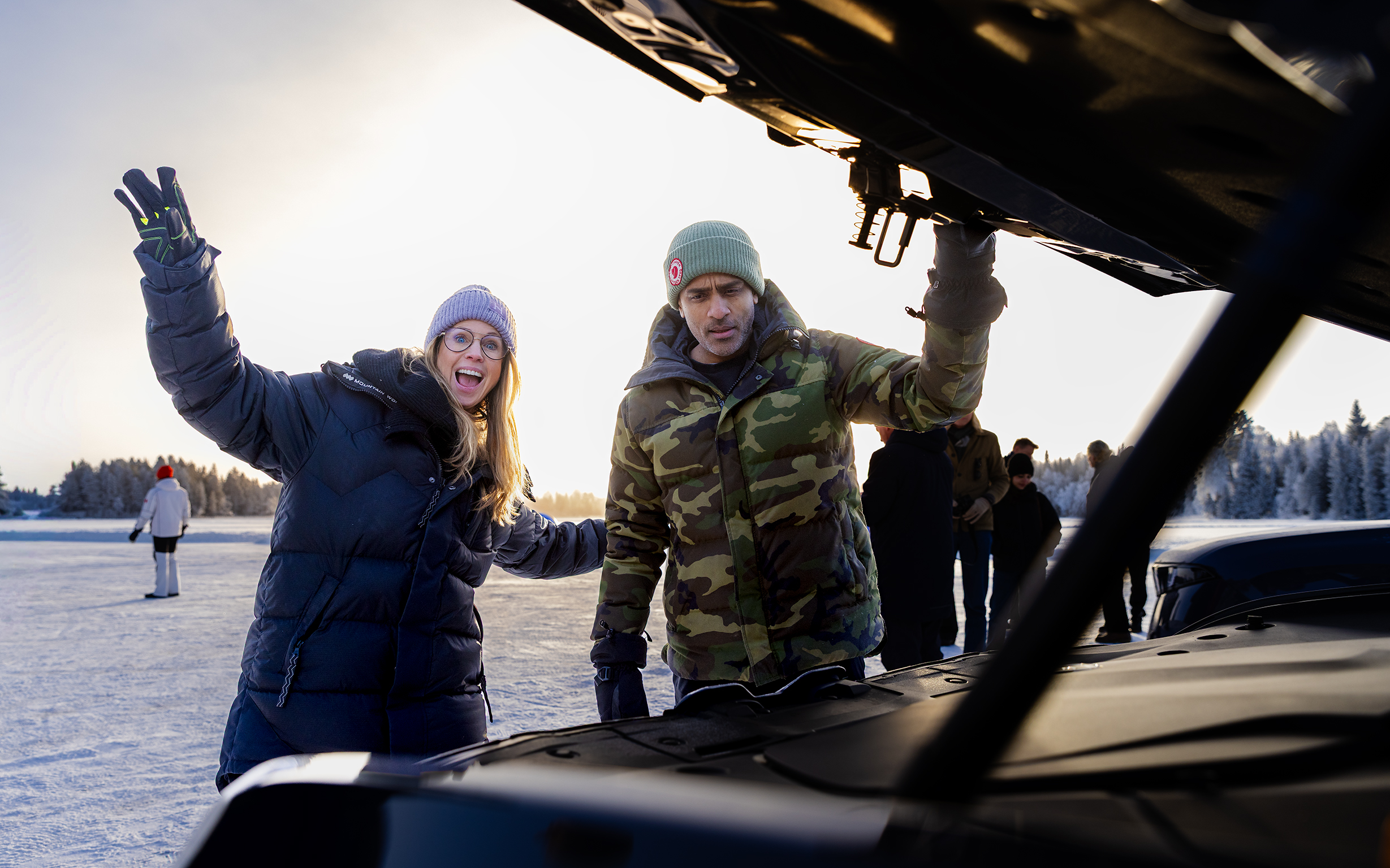 Guests cheering on the frozen lake during the ice driving day