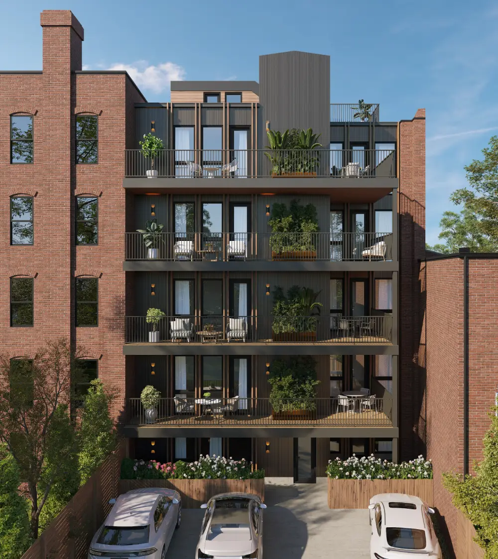 Rear view of a modern multi-story apartment building with balconies, potted plants, and parked cars below.