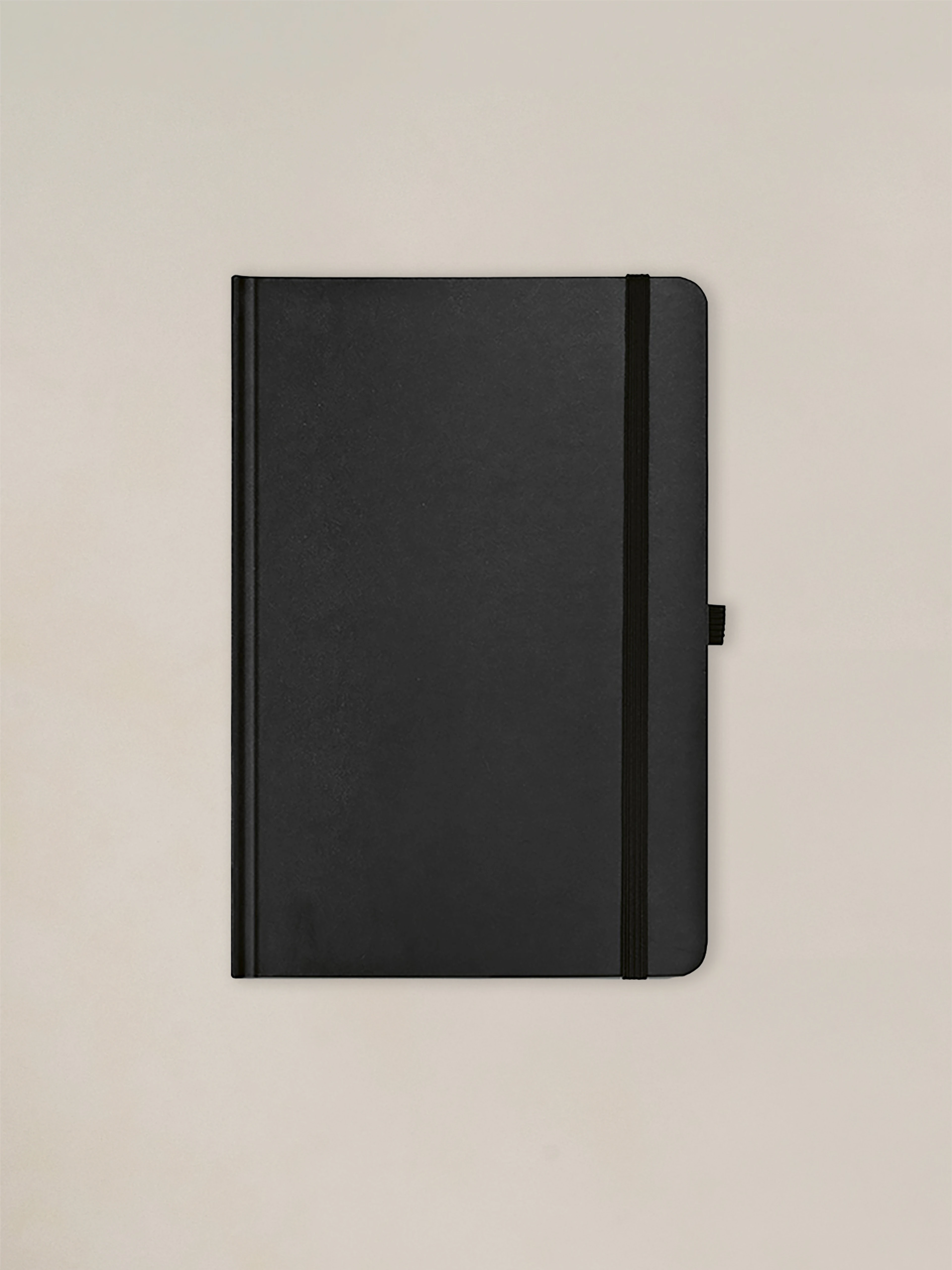 A colorful, eco-friendly notebook made from 100% recycled materials, with dated pages, a ribbon bookmark, and an elastic closure, designed for everyday use.